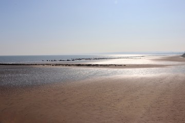 Fototapeta na wymiar Deserted beach on a spring day with clear skies