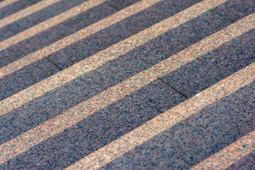 Background of granite steps lit by the setting sun.