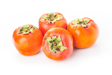 Delicious fresh persimmon fruit on wooden table.