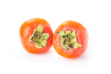 Delicious fresh persimmon fruit on wooden table.