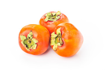 Delicious fresh persimmon fruit on wooden table.