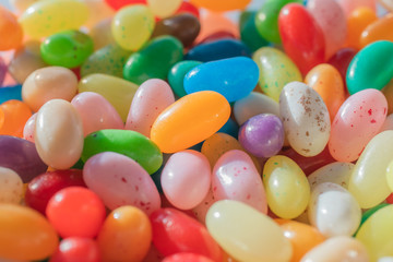 Fototapeta na wymiar Colorful candy beans as texture and background for design. Close up view of jelly candy beans.