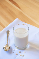 glass of milk on wooden and White cloth