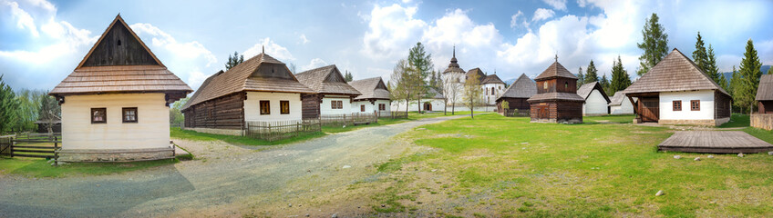 Fototapeta na wymiar Old traditional wooden houses of village Pribylina in Liptov region (SLOVAKIA) - PANORAMA