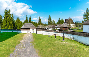 Churchyard with burial crosses - church of the Virgin Mary in village Pribylina  (SLOVAKIA)
