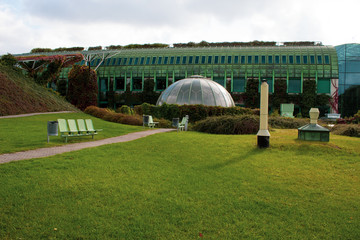  An unusual roof garden of the city university library with glass domes, stairs, trees and flowers in Poland.