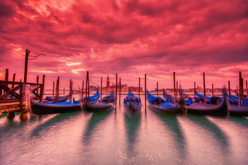 Fototapeta na wymiar Gondolas moored by Saint Mark square, Venice, Italy, Europe.