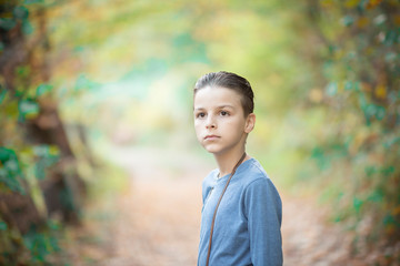 handsome boy, portrait outdoor with natural autumn background