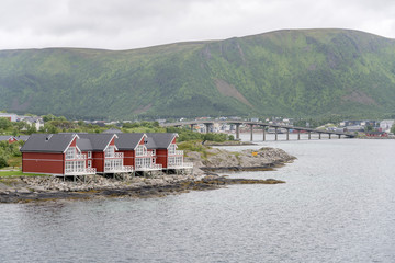 Naklejka premium traditional houses on shore and bridge, Stokmarknes, Norway