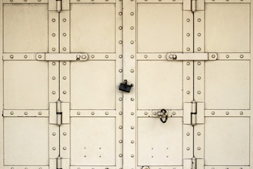 Iron door closed with a lock