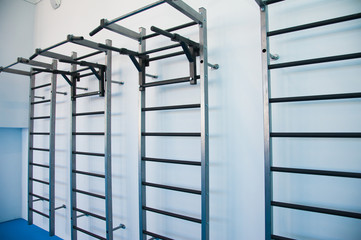 Wall bars in the gym. Wall bars in the school gymnastic hall