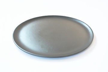 black ceramic plate on white background