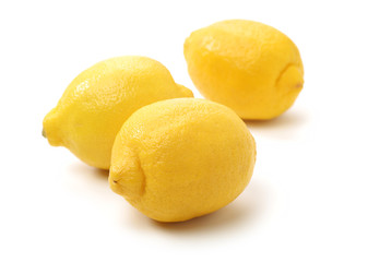 Ripe lemons on white background
