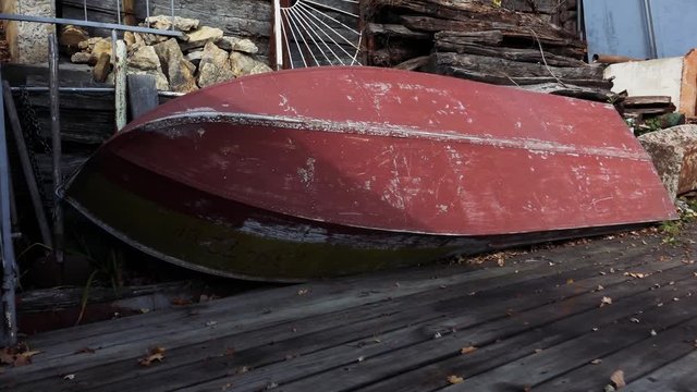 an old abandoned boat lying near the pier