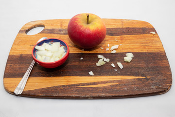 Apple onion wood and spoon as a reciept to cure a cold