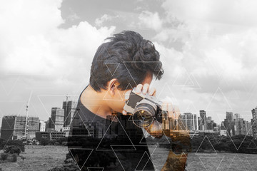 asian man photographer with old camera in city abstract background
