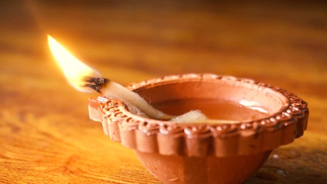 Diwali festival lamp on wooden background