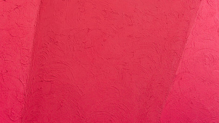 Red folded and rough concrete wall outside the biulding. Background image.