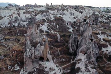 Top view of rocks in popular travel destination - Cappadocia in Turkey. Paths and caves among mountains