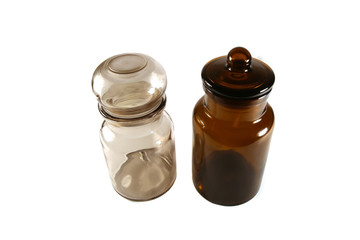 Glass bottles with stopper isolated on white background. Vintage brown empty glass bottles..
