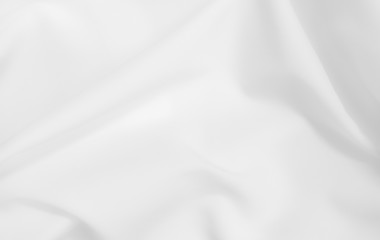 Abstract white fabric texture background. Cloth soft wave. Creases of satin, silk, and cotton.