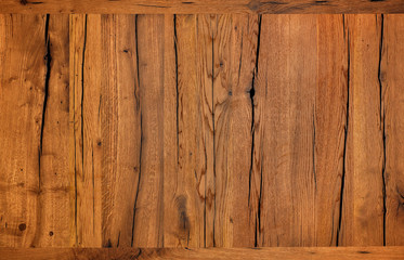 Texture and background of very old cracked brown wood after protective treatment.