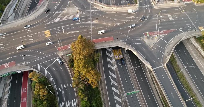 Lanes and intersections on Warringah freeway with complex infrastructure of toll road, bus lanes, exits, bridges in aerial top down view.