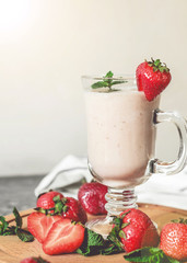 strawberry smoothie with mint on the table, front view
