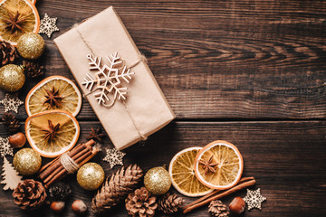 Christmas background, celebration, New Year's eve party, sale, presents concept. Beautiful gift box with handmade embellishments and food decorations, template with copyspace