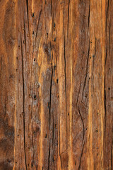 Texture and background of a very old brown wood, vertical image.