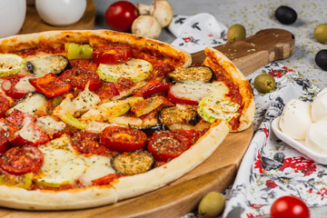 Vegetarian Pizza made with zucchini, mozzarella, pepper, eggplant and tomato.