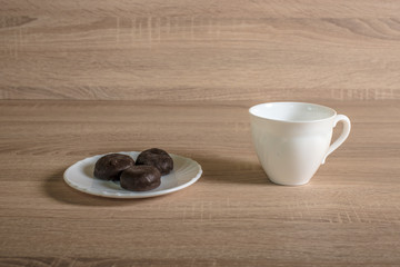 cup with chocolates on a plate