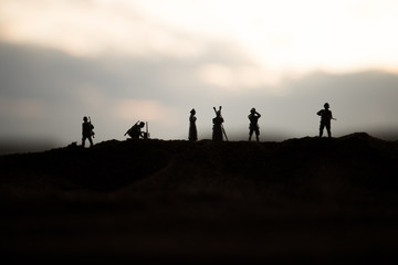 War concept. Creative composition. Silhouette of German general at the desert. Army commanders watching to the battle.