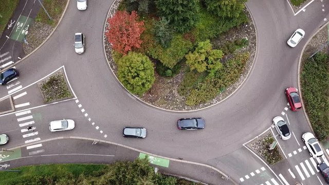 Transportation, aerial view of cars on the road, traffic on roundabout top view from drone