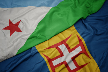 waving colorful flag of madeira and national flag of djibouti.