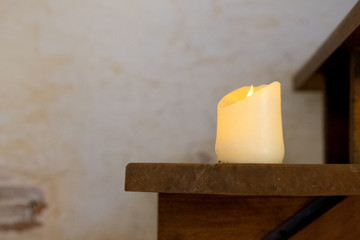 Light candle put on wooden staircase