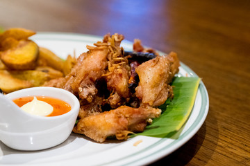 Fried chicken legs wings and french fries