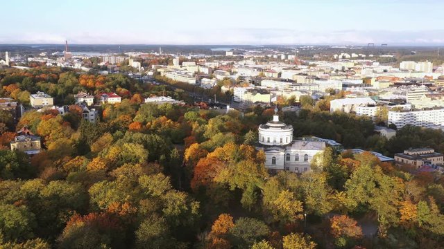 City skyline and fall foliage in Turku, Finland. UHD 4K Aerial View.