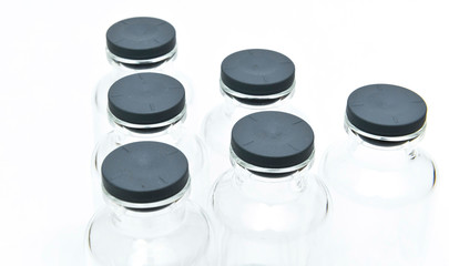 Close up of rubber sealing cap of medical vials on the white background