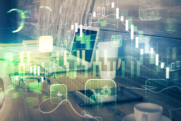 Financial graph colorful drawing and table with computer on background. Double exposure. Concept of international markets.