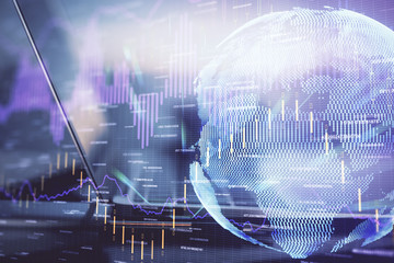 Financial graph colorful drawing and table with computer on background. Double exposure. Concept of international markets.