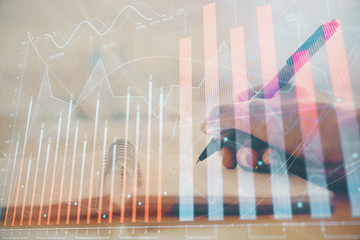 Forex graph on hand taking notes background. Concept of research. Multi exposure