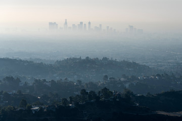 Thick hazy layer of smog and smoke from nearby brush fire clouding the view of downtown Los Angeles...