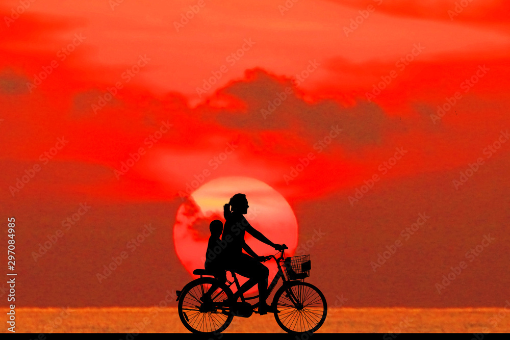 Sticker silhouette happy family  and bike  on sunrise