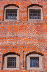 Windows with bars of medieval prison