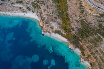 Top view aerial photo of ocean seashore with beautiful color from flying drone. Wonderful seascape with copy space for advertising text message. Perfect background for travel website Horizontal photo.