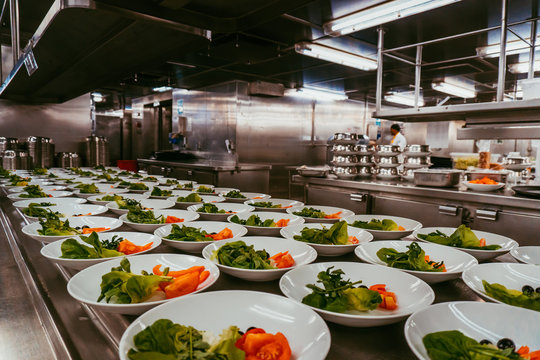 Many Plates With Salad. Preparation For Lunch Service On A Cruise Ship.