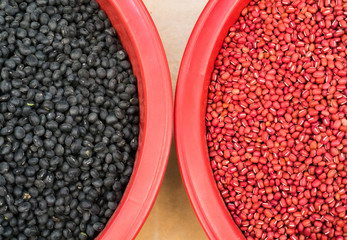 Red and black beans are on the table.