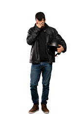 Fototapeta premium Full-length shot of Biker man with tired and sick expression over isolated white background
