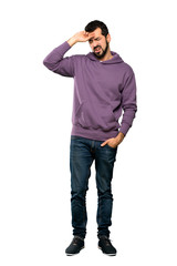 Fototapeta premium Full-length shot of Handsome man with sweatshirt with tired and sick expression over isolated white background